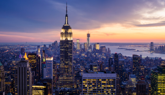 the New York City skyline at sunset